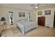 Serene main bedroom with neutral walls, tile flooring, and two windows providing ample light at 1203 Hudson Rd, Venice, FL 34293