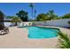 Landscaped backyard featuring a swimming pool and patio at 1203 Hudson Rd, Venice, FL 34293