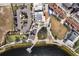 Aerial view of a charming town center, playground, cafe, shops and waterfront pier at 12538 Somatic Ct, Venice, FL 34293