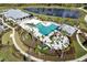 Aerial view of a community pool, spa, and lake at 12538 Somatic Ct, Venice, FL 34293
