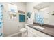 Bathroom featuring coastal decor, a window, and a modern toilet at 12538 Somatic Ct, Venice, FL 34293