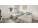 Bright bedroom with two twin beds and coordinated decor at 12538 Somatic Ct, Venice, FL 34293