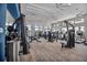 Bright fitness center with exercise machines, weights, and large windows offering views at 12538 Somatic Ct, Venice, FL 34293