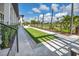 Enjoy a game of lawn bowling in this beautifully landscaped outdoor activity area at 12538 Somatic Ct, Venice, FL 34293