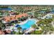 Aerial view of a resort-style community with pool, lakes and lush tropical foliage at 13829 Alafaya St, Venice, FL 34293