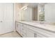 Bright bathroom with double sinks, granite countertops, and a walk-in shower at 13829 Alafaya St, Venice, FL 34293