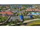 The community bocce ball courts are surrounded by manicured landscaping near upscale lakeside homes at 13829 Alafaya St, Venice, FL 34293