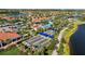 A neighborhood has four bocce ball courts and is surrounded by lush landscaping and upscale homes at 13829 Alafaya St, Venice, FL 34293