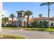 Exterior of a beautiful clubhouse with multiple arches, tile roof and lush landscaping at 13829 Alafaya St, Venice, FL 34293