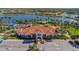 A large community clubhouse features barrel tile roofing, manicured grounds, and ample parking at 13829 Alafaya St, Venice, FL 34293