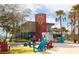 Downtown building with red and gold detail, next to colorful casual seating at 13829 Alafaya St, Venice, FL 34293
