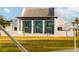 Bright white building with multiple entry doors and glass windows, under a light-colored roof at 13829 Alafaya St, Venice, FL 34293