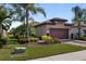 Charming home featuring a well-manicured lawn and two-car garage at 13829 Alafaya St, Venice, FL 34293