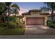 Charming single-story home with a brick driveway, well-manicured landscaping, and an attached two-car garage at 13829 Alafaya St, Venice, FL 34293