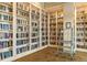 Library featuring floor-to-ceiling bookshelves filled with a wide variety of books at 13829 Alafaya St, Venice, FL 34293