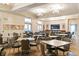 Large meeting room with multiple tables and chairs, and a small kitchenette at 13829 Alafaya St, Venice, FL 34293