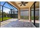 Screened-in patio with brick flooring, ceiling fan, and serene outdoor views at 13829 Alafaya St, Venice, FL 34293