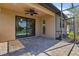 Covered outdoor patio featuring brick floors, ceiling fan, and water views at 13829 Alafaya St, Venice, FL 34293