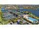 Well-maintained community tennis courts next to a pool and a scenic lake provide recreation opportunities at 13829 Alafaya St, Venice, FL 34293