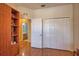 Cozy bedroom with a built-in shelving unit and access to the bathroom at 1438 Maseno Dr, Venice, FL 34292