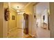 Warm foyer featuring tile flooring, a grandfather clock, and an inviting entrance at 1438 Maseno Dr, Venice, FL 34292