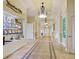 Well-lit hallway featuring tiled floors and trophy display at 1438 Maseno Dr, Venice, FL 34292