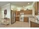 Well-lit kitchen featuring stainless steel appliances and a tile floor at 1438 Maseno Dr, Venice, FL 34292