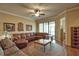 Well-designed living room featuring a dining area with hardwood floors and ample seating at 1438 Maseno Dr, Venice, FL 34292