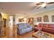Open living area with hardwood floors, decorative touches, and a cozy atmosphere at 1438 Maseno Dr, Venice, FL 34292