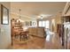 Inviting living room featuring hardwood floors, a ceiling fan, and a comfortable seating area at 1438 Maseno Dr, Venice, FL 34292