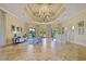 Lobby with tiled floors, elegant seating, and chandelier at 1438 Maseno Dr, Venice, FL 34292
