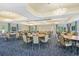 Meeting room with tables, chairs, and elegant lighting at 1438 Maseno Dr, Venice, FL 34292