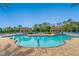 Relax by the pool with shaded seating areas and clear blue water at 1438 Maseno Dr, Venice, FL 34292