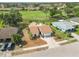 Aerial view of home showing the roof, driveway, lawn, landscaping, and the surrounding neighborhood at 1439 Strada D Argento, Venice, FL 34292