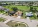 Extensive aerial view of house and its community, including the golf course, landscaping, and surrounding area at 1439 Strada D Argento, Venice, FL 34292