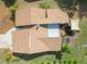 Aerial view of home featuring a backyard patio and well-manicured lawn at 1439 Strada D Argento, Venice, FL 34292