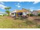 Inviting backyard patio with comfortable seating beneath a modern shade structure and a view of the home at 1439 Strada D Argento, Venice, FL 34292