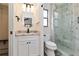 Beautiful bathroom with marble shower, granite countertop, and modern fixtures at 1439 Strada D Argento, Venice, FL 34292