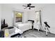 Bright bedroom with ceiling fan and natural light, a perfect game room or bedroom at 1439 Strada D Argento, Venice, FL 34292