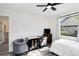 Bright bedroom featuring modern ceiling fan, gaming area and updated flooring at 1439 Strada D Argento, Venice, FL 34292