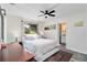 Comfortable bedroom with a ceiling fan and plenty of natural light from the window at 1439 Strada D Argento, Venice, FL 34292
