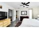 Bright bedroom with updated flooring, modern ceiling fan, and view to other living spaces at 1439 Strada D Argento, Venice, FL 34292