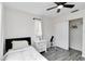 Bright bedroom with ceiling fan, natural light, wood-look flooring, and storage at 1439 Strada D Argento, Venice, FL 34292