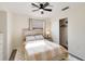 Bright bedroom with ceiling fan, and wood-look furniture, including a sliding door closet at 1439 Strada D Argento, Venice, FL 34292