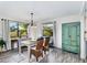 Bright dining room features large windows and elegant furnishings, perfect for entertaining at 1439 Strada D Argento, Venice, FL 34292