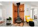 Living room showcases stone fireplace, bright walls, wood floors, and view to other rooms at 1439 Strada D Argento, Venice, FL 34292