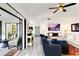 Bright living area with modern sliding glass doors and comfortable seating arrangement at 1439 Strada D Argento, Venice, FL 34292