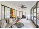 Sunroom with tile flooring and views into living room and bedroom at 1439 Strada D Argento, Venice, FL 34292