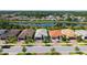 Aerial view of a well-maintained property in a lovely neighborhood with lush greenery at 1481 Hyssop Loop, North Port, FL 34289