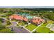 Aerial view of clubhouse, pool, tennis courts, garden, bocce ball and horseshoe areas at 1481 Hyssop Loop, North Port, FL 34289